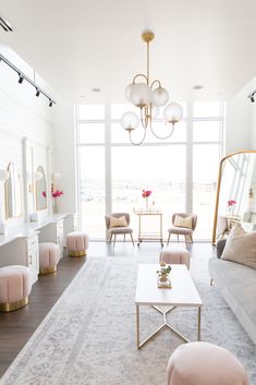 a living room filled with furniture and a large window