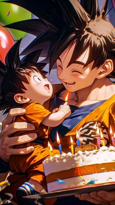 a man holding a child in front of a birthday cake