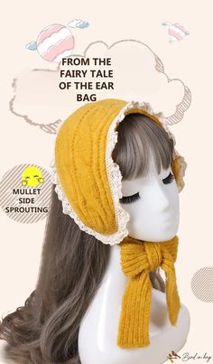 a mannequin head wearing a yellow knitted hat and scarf with the text from the fairy tale of the ear bag