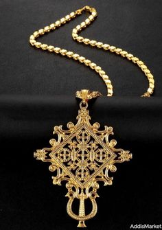 Traditional Habesha Gold-Plated Cross Pendant | Addis Market Ethiopian Traditional Dress, Habesha Kemis, Phones For Sale, Gold Cross Necklace, Cross Earrings, Traditional Dress, Gold Cross