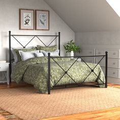 a bedroom with a bed and dressers in it