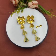 Freshwater Pearl Flower Earrings | 80mm 22k Gold Plated Handmade Earrings | Wedding Bridesmaid Floral Earrings | Dangle Earrings | Gift Idea. ZL279 Material: 22kt Gold Plated Brass Earrings Size: 80x25mm approx Pearl Size: 7mm approx Quantity: 1 Pair It's a perfect gift for mom, daughters, sisters, wife, bridesmaids, girlfriends, your best friend, and yourself. It's handmade with love for all occasions, such as bridal, wedding, anniversary, birthday, Mother's day, Valentine's Day, Christmas, and New Year's. A wonderful addition to any woman's jewelry collection. This product has been made by hand and may have slight irregularities that are a natural outcome of the human involvement in the process. ------------------------------- Click here to check more of our one of a kind earrings:- http Gold Metal Flower Earrings For Wedding, Gold Flower Chandelier Earrings Elegant Style, Gold Flower-shaped Elegant Chandelier Earrings, Elegant Gold Flower Chandelier Earrings, Dangle Metal Flower Earrings For Wedding, Gold Plated Dangle Flower Earrings For Wedding, Metal Dangle Flower Earrings For Wedding, Metal Flower-shaped Earrings For Wedding, Metal Flower Shaped Earrings For Weddings