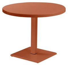 a round table with an orange base on the top, viewed from the front view