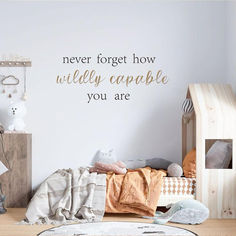 there is a wall decal that says never forget how wildly capable you are in this room