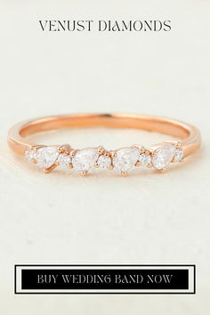 a wedding band with three pear shaped diamonds on it and the words, buy wedding band now