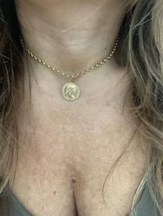 "Lovely 14k yellow gold coin medallion choker. This choker is a great statement piece that can transition any outfit from day to night. The 17\" choker secures with a lobster clasp that can be adjusted anywhere from 13\"-17\", making it great for layering! *Approximate weight: 8.1 grams *Adjustable length: 13\"-17\" Upgrades for FedEx/UPS guaranteed 2-day delivery are available and can be selected prior to checkout without separate invoicing. It is generally not an issue, but the USPS cannot gua Gold Coins, Statement Pieces, Mother’s Day, Valentine Gifts, Charm Necklace, Anniversary Gifts, Gold Necklace, Yellow Gold, Valentines