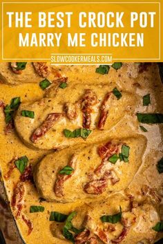 the best crock pot mary me chicken in a casserole dish with spinach garnish