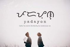 two people standing next to each other with the words padayon written on them