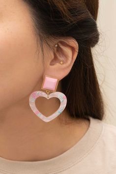 Pink heart earrings with printed flowers give off a 2000s pop star vibe.Sterling Silver Post10k Gold PlatingMeasurement:2in x 1.7in / 5.08cm x 4.32cmStyle: CuteMaterial Composition: Sterling Silver Post10k Gold PlatingCare Instructions: Keep jewelry away from prolonged exposure to moisture. Before any activity, take off the jewelry and store it in a dark and dry place. This includes activities such as showering, swimming, or exercising. If the jewelry does get exposed to these conditions, rinse 2000s Pop Star, Star Vibe, 2000s Pop, Luxury Stuff, Printed Flowers, Pink Heart Earrings, Coconut Wax Candles, Womens Watches Luxury, Keep Jewelry