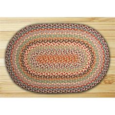 the oval rug is made from wood and has multicolored braiding