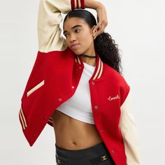 A symbol of team spirit and authentic American cool this vintage-inspired varsity jacket is an iconic Coach silhouette. Crafted in a mix of recycled wool and recycled polyester it's finished with smooth leather sleeves welt pockets signature striped ribbed trim and our embroidered cursive Coach script. | Coach Varsity Jacket - Women's Size XS - Red Casual Streetwear Outerwear With Signature Stripes, Casual Outerwear With Signature Stripes For Streetwear, Long Sleeve Outerwear With Signature Stripes For Streetwear, Red Varsity Jacket With Ribbed Cuffs For College, Retro Varsity Jacket With Contrast Collar For Fall, Sporty Varsity Jacket For Fall Campus, Sporty Varsity Jacket For Campus In Fall, Sporty Fall Varsity Jacket For Campus, Red Varsity Jacket With Baseball Collar For Game Day