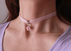 "Velvet light pink ribbon choker with sculpted powder pink rose. Material of rose is polymer clay. Each petal of flower made by hand Dia flower about 13-15 mm/0.45- 0.55 \" Length of necklace is adjustable: 10-12 inches/ 25,4 - 30,5 cm 11-13 inches/ 28-33 cm 12-14 inches/ 30.5- 35.5 cm 13-15 inches/ 33-38 cm 14-16 inches/ 35.5 cm-40.5 cm 15-17 inches/ 38,1 cm- 43,2 cm 16-18 inches/ 40.6 cm- 45.7 cm 17-19 inches/ 43 cm - 48 cm 18-20 inches/ 45,5- 50.8 cm Τhe length you choose considered to be wit Handmade Pink Choker As Gift, Handmade Pink Choker As A Gift, Rose Design Choker Necklace, Pink Feminine Choker Jewelry, Feminine Pink Choker Jewelry, Gift Rose Design Choker In Rose Color, Adjustable Pink Necklace With Rose Design, Rose Design Choker As Gift, Delicate Pink Choker For Gift