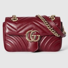 "Find GUCCI Gg Marmont Mini Shoulder Bag Leather on Editorialist. Presenting the House's red hue Gucci Rosso Ancora on the GG Marmont, this mini shoulder bag presents the iconic style in a signature color for Pre-Fall, complete with light gold toned hardware and ivory leather lining. Gucci Rosso Ancora matelassé chevron leather, Light gold toned hardware, Ivory leather lining, Double G, Sliding chain strap can be worn as a shoulder strap with 55cm drop or can be worn as a top handle with 30cm dr Classic Quilted Gucci Shoulder Bag, Classic Red Quilted Shoulder Bag, Designer Gucci Quilted Bags, Luxury Quilted Gucci Bag, Formal Quilted Gucci Bag, Gucci Quilted Formal Shoulder Bag, Gucci Red Bag, Marmont Gucci Bag, Gg Marmont Matelassé Mini Bag