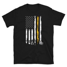 a t - shirt with an american flag and tools on the front, in yellow