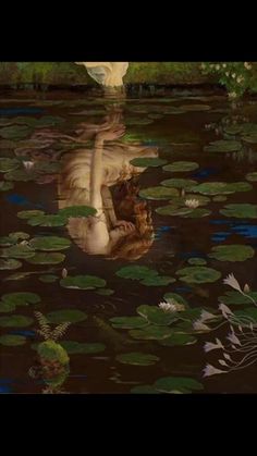 a painting of a woman floating in the water with lily pads