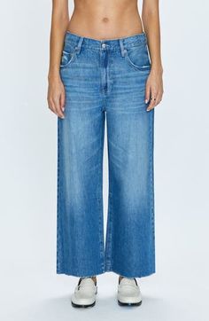 A faded wash and raw-edge hems complete these wide-leg jeans cut from nonstretch denim. 26" inseam; 25" leg opening; 11" front rise; 15" back rise (size 29) Zip fly with button closure Five-pocket style 62% cotton, 38% lyocell Machine wash, tumble dry Imported Faded Flare Jeans With Straight Hem, Faded Wide Leg Relaxed Fit Flare Jeans, Faded Relaxed Fit Wide Leg Flare Jeans, Faded Wide Leg Flare Jeans With Relaxed Fit, Denim Blue Washed Cropped Flare Jeans, Washed Denim Blue Cropped Flare Jeans, Faded Wide Leg Washed Flare Jeans, Fall Washed Wide Leg Cropped Jeans, Wide-leg Washed Cropped Jeans For Fall