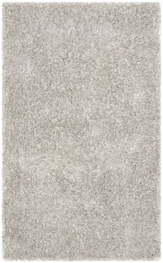 Shimmering with the luster of satin, Toronto shag rugs radiate style and sophistication. A brilliant blend of textured yarns infuse this collection with striking highlights and comforting texture. Hand-tufted using soft synthetic yarns, Toronto shags boast a cushioned feel underfoot and high performance in any room. Now available in smart selection of boho-chic designs.Pile Height: 1.25 inches Grey Shag Rug, Light Grey Rug, Solid Area Rugs, Grey Color Palette, Textured Yarn, Contemporary Bedroom Decor, Grey Rug, Light Grey Area Rug, Luminous Colours