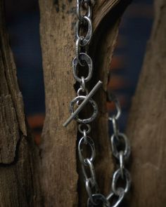 Hammered Oval Linked Silver Bracelet, crafted from 95% pure silver, adorned with the "Pod duang" symbol for prosperity. Featuring a charcoal finish and unique hammered design, it combines traditional symbolism with modern elegance, secured with a toggle clasp.  The "Phod Duang" pattern is a treasured Thai design inspired by ancient coins. Its intricate, circular motifs grace textiles and crafts, carrying deep meaning. This pattern is believed to bring wealth and fill life with happiness.  Each piece has its own distinct design and significance. By wearing Taki jewelry, you support local craftsmanship and help preserve the traditional way of life and culture of Karen artisans. Sizing :  One : length: 20.3 cm , Fits wrists up to 19 cm. Can be adjusted to fit your wrist. Artisan Engraved Sterling Silver Bracelet, Handmade Symbolic Sterling Silver Bracelets, Spiritual Sterling Silver Bracelet With Polished Finish, Oxidized Finish Link Jewelry For Gift, Symbolic Sterling Silver Bracelet, Link Jewelry With Oxidized Finish As Gift, Sterling Silver Bracelet With Oxidized Finish For Everyday, Everyday Sterling Silver Bracelet With Oxidized Finish, Artisan Sterling Silver Bracelet With Polished Finish