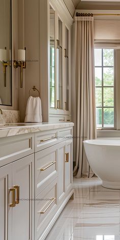 a large white bath tub sitting in a bathroom next to a window with curtains on it