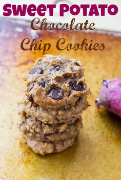 a stack of cookies sitting next to a purple potato