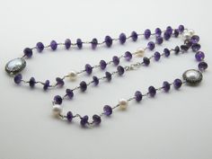 Amethyst is paired with a pearl in a necklace that is perfect for artists This is a stunning, natural necklace made from high-quality materials, amethyst, baroque pearls, Amethyst is associated with the Magical. Length 15 inç. ( 38 cm. ) Neck circumference 30 inç. (76 cm. ) Sending me requests and suggestions, please feel free to convo The product will be sent within a gift box and a gift bag For other inquiries, please visit the shop policies Thank you for visiting our shop http://www.etsy.com/ Briolette Natural Stone Necklace For Wedding, Elegant Amethyst Rondelle Necklaces, Elegant Amethyst Rondelle Necklace, Elegant Amethyst Gemstone Bead Necklaces, Elegant Amethyst Gemstone Beads Necklace, Wedding Pearl Necklaces With Natural Stones, Wedding Necklaces With Natural Stones And Pearls, Elegant Amethyst Round Bead Necklaces, Elegant Amethyst Necklaces With Round Beads