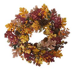 a wreath with autumn leaves and acorns