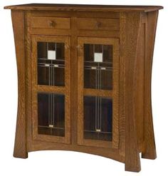 a wooden cabinet with glass doors on the top and bottom shelf, in an oak finish