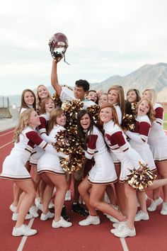 a group of cheerleaders posing for a photo