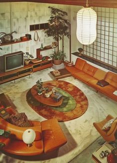 a living room filled with lots of furniture and a large rug on top of the floor