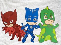 three children's paper cut outs of superheros and green lantern, catboy, and robinette