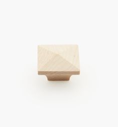 a wooden knob on a white background