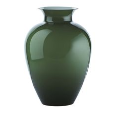 a large green vase sitting on top of a white table