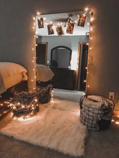 a bedroom with lights strung from the ceiling, and a rug on the floor in front of it