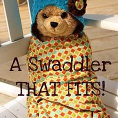 a teddy bear wrapped in a blanket with the words, a swaddleer that fits