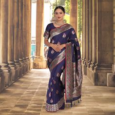 Introducing our lovely Malai Silk banarasi saree in Navy Blue! This beautiful saree is woven in traditional banarasi pattern and features exquisite Meena booti work. The fall and pico are done, and the blouse is stitched and ready to go - meaning you can wear it right away! The Navy Blue color is perfect for any occasion, whether it's a festive party or a traditional wedding. And the best part? Our Malai Silk sarees are extremely comfortable to wear, thanks to the soft and lightweight fabric. So Festive Blue Meenakari Saree, Fitted Blue Banarasi Silk Saree, Banarasi Pattern, Navy Blue Banarasi Saree, Blue Embroidered Banarasi Silk Saree, Blue Banarasi Saree, Blue Handloom Banarasi Silk Pre-draped Saree, Silk Banarasi Saree, Banarasi Saree