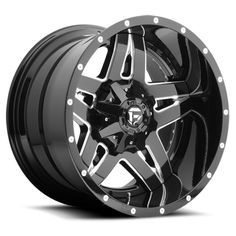 a black and chrome wheel on a white background