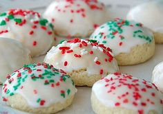 cupcakes with white frosting and colorful sprinkles