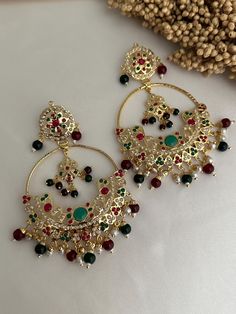 Traditional Punjabi jadau earrings . very lightweight earrings .  Style tip- ----------- Pair it with any beautiful traditional outfits  and flaunt with Unique style of collection from us. Perfect match for Festival and Traditional wear.  Take Care Tips-  ---------------- Kee away from perfume, Hair spray and. Moisture.  Store in dry place , Ziplock bag or Airtight box.    Clean with dry cloth.  Jewellery is the last thing you should wear and first thing you should remove.  ------------------------------------------------ For customers outside Canada-  Some Countries apply import Duties and Taxes on goods which will be paid by customers . Please check your local regulations for more information. Please message me if anyone inquire about product.  Happy shopping  Thank you for supporting my Luxury Kundan Danglers As Gift, Luxury Traditional Beaded Earrings For Gift, Luxury Traditional Beaded Earrings As Gift, Green And Pink Jewellery Set, Green Tikka Jewelry, Jadau Set, Jadau Earrings, Cloth Jewellery, Ziplock Bag