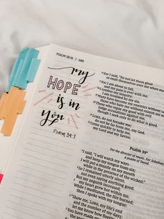 an open bible with the words, my hope is in you on it next to colored crayons