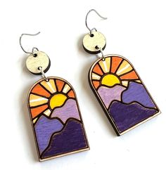 Love these mountain range earrings!  Colorful and bold.  Perfect for anyone who loves the outdoors! The colors are hand painted on top of lightweight wood, and the mountains and sun are laser etched.   You can choose silver plated hooks or solid sterling hooks. The earrings are water resistant, however it is best to take these earrings off before showering, swimming, or rolling in puddles!   A great gift for that special someone who has everything! Landscape Sunrise, Mountain Earrings, Concord Nh, Laser Cut Wood Earrings, Laser Cut Wood Crafts, Earrings Colorful, Colorful Landscape, Wood Earrings, Mountain Range