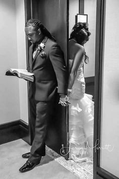 a bride and groom standing in an elevator