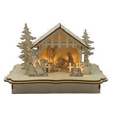 an illuminated nativity scene in the shape of a house