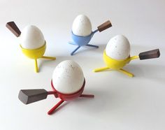 four eggs are placed in different shapes and sizes