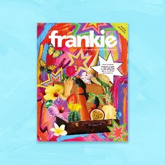 the front cover of frankie magazine on a blue background with flowers and fruit in it