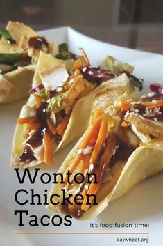 two tacos on a white plate with the words wonton chicken tacos