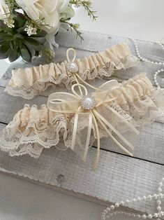 Ivory Lace Bridal Garter Set Beautiful garter in ivory lace and a pearl accent Sale is final, but 100% satisfaction guaranteed. Please contact us if there are any issues with your purchase. Elegant Cream Wedding Dress For Ceremony, Fitted Cream Lace For Wedding Night, Cream Lace Wedding Dress For Bride, Elegant Cream Lace For Bride, Fitted Cream Bridal Accessories For Ceremony, Cream Wedding Dress With Delicate Lace, Cream Lace Bridal Accessories For Wedding, Beige Wedding Lace With Lace Trim, Cream Lace Wedding Dress For Ceremony