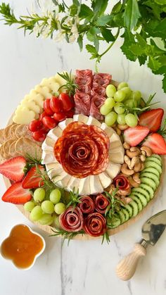 a platter filled with fruits and vegetables