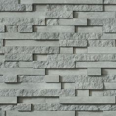 a wall made out of grey stone blocks