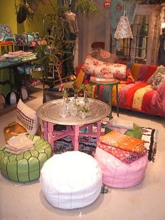 a living room filled with lots of colorful furniture