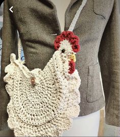 a crocheted bag with a rooster on the front and side, attached to a mannequin's torso